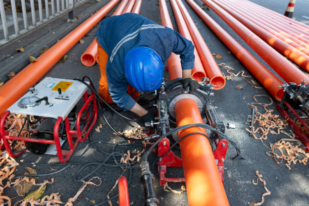an engineering worker is repairing a pipeline